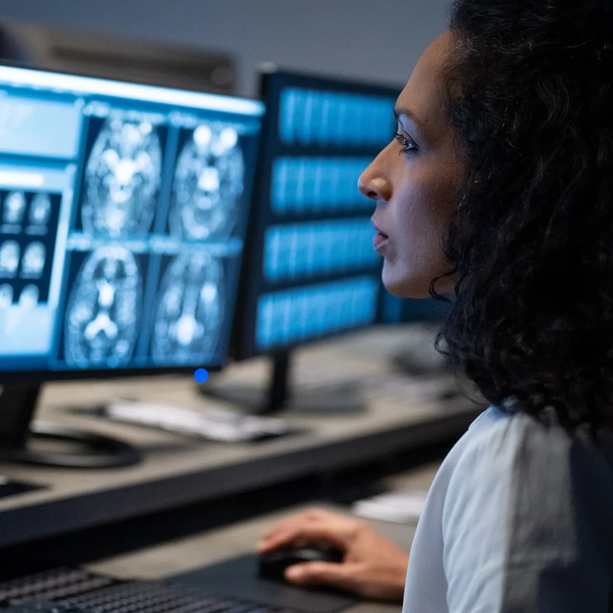 Female doctor looking at scan results on a computer screen