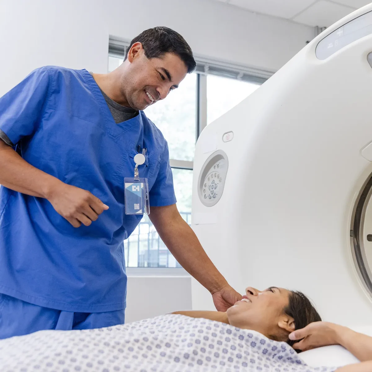 Female patient smiling and about to do a medical scan